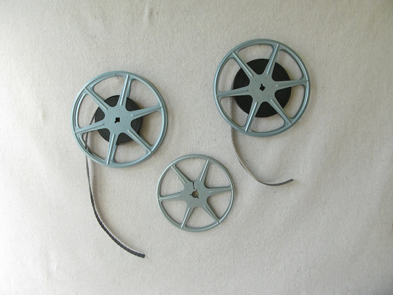 The same taste in movies.  Vintage movie real canisters from PassedBy.